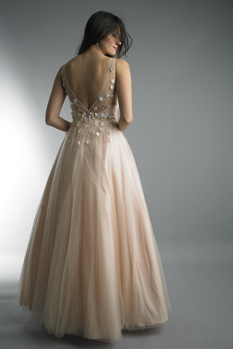 Sleeveless evening gown with floral accents